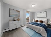 Thumbnail 7 of 33 - a bedroom with a bed and a window