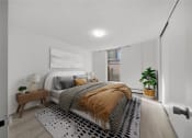 Thumbnail 8 of 33 - a bedroom with a bed and a rug
