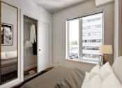 Thumbnail 56 of 78 - A bedroom with a large bed and a wardrobe.