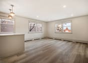 Thumbnail 57 of 219 - A room with wooden floors and white walls.