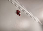 Thumbnail 217 of 219 - A red fire alarm on a white wall.