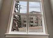 Thumbnail 216 of 219 - A window with a view of a street and buildings outside.