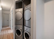 Thumbnail 177 of 219 - A row of washing machines in a laundry room.