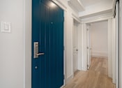 Thumbnail 128 of 219 - A blue door with a silver handle and a white door with a silver handle.