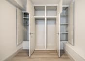 Thumbnail 130 of 219 - A white hallway with open doors leading to other rooms.