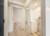 Thumbnail 126 of 219 - A white door is open to a room with a wood floor.