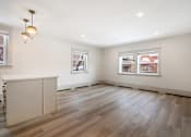 Thumbnail 123 of 219 - A room with wooden floors and a white cabinet.