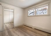 Thumbnail 89 of 219 - A room with a sliding door and a window.