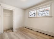 Thumbnail 88 of 219 - A room with a large window and a door.