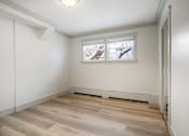 Thumbnail 96 of 219 - A room with a window and a radiator on the floor.