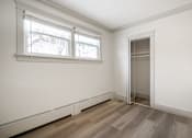 Thumbnail 94 of 219 - A room with a window and a door.