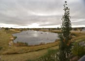 Thumbnail 8 of 30 - Aqua residential rental apartments next to pond and walking paths