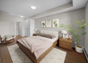 Thumbnail 3 of 72 - a bedroom with white walls and wood floors and a bed