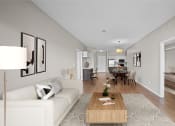Thumbnail 1 of 72 - a living room and dining room with a couch and a table