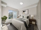 Thumbnail 6 of 72 - a bedroom with a bed and a window