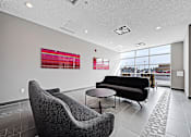Thumbnail 24 of 27 - A modern waiting room with a view of the city.