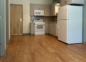 Thumbnail 22 of 34 - A kitchen with a refrigerator, oven, and microwave.at Benedict, The, Colorado