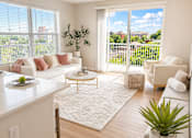 Thumbnail 2 of 28 - Bright open-concept living room at 200 Main Kannapolis with oversized windows, modern furnishings, and downtown views.