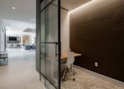 Thumbnail 10 of 66 - Quiet work nook with glass doors and modern lighting at The Rail at Bound Brook in Bound Brook, NJ.