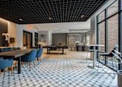 Thumbnail 45 of 66 - Resident clubroom at The Rail at Bound Brook featuring a pool table, large dining table, and natural light in Bound Brook, NJ.