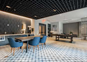 Thumbnail 47 of 66 - Game and lounge area at The Rail featuring pool table, modern seating, and decorative accents in Bound Brook NJ.