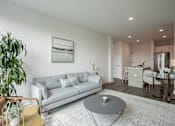 Thumbnail 23 of 66 - Bright open-concept apartment at The Rail at Bound Brook with a modern kitchen, living area, and dining nook—perfect for luxury downtown living.