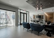 Thumbnail 3 of 66 - View of The Rail at Bound Brook’s front entrance lobby with lounge seating and glass walls.