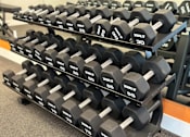 Thumbnail 64 of 66 - Luxury gym at The Rail at Bound Brook with strength training equipment and stylish design, offering fitness perks to residents in a pet-friendly Bound Brook apartment community.
