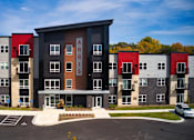 Thumbnail 18 of 102 - Apartment complex with the name "ARRIYS" on the front building.