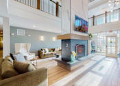 Thumbnail 20 of 102 - A living room with a fireplace and a television.