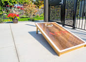 Thumbnail 43 of 102 - A shuffleboard table with red letters on it.