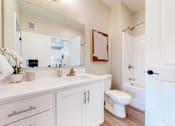 Thumbnail 71 of 102 - A white bathroom with a toilet in the corner.