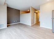 Thumbnail 84 of 102 - A room with a white ceiling and a wooden floor.