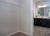 Thumbnail 23 of 98 - A bathroom with a white towel rack and a mirror.