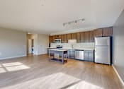 Thumbnail 37 of 98 - A kitchen with a wooden counter top and stainless steel appliances.