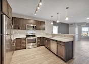 Thumbnail 47 of 98 - A modern kitchen with stainless steel appliances and wooden cabinets.