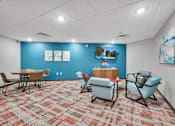 Thumbnail 73 of 98 - A room with a blue wall and a carpet with a red and beige pattern.