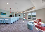 Thumbnail 79 of 98 - A modern living room with a bar area and comfortable seating.
