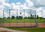 Thumbnail 94 of 98 - A baseball field is enclosed by a chain link fence.