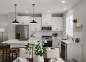 Thumbnail 1 of 16 - A modern kitchen with a dining table set for two.