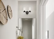 Thumbnail 7 of 16 - A bathroom with a white sink and a mirror above it.