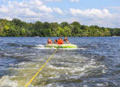 Thumbnail 21 of 24 - kids on an inflatable raft on Lake Murray at The Residence at Marina Bay, Irmo