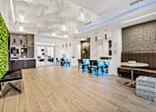 Thumbnail 2 of 18 - A modern dining area with a green wall and wooden floors
