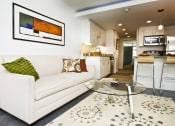 Thumbnail 11 of 18 - Living Room With Kitchen View at The Palms on Main, South Carolina, 29201