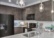 Thumbnail 11 of 20 - Granite Counter Tops In Kitchen at Residence at Tailrace Marina, Mount Holly, North Carolina