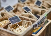 Thumbnail 26 of 27 - a box of rice with two cell phones on top of it