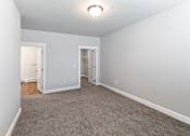 Thumbnail 28 of 53 - A room with carpeted floor and white walls.at The Brix Apartments, Spokane Valley, Washington