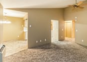 Thumbnail 35 of 73 - A room with a ceiling fan and carpeted floor at Graymayre Crossing Apartments, Spokane, 99208