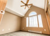 Thumbnail 51 of 73 - A room with a ceiling fan and a window with blinds at Graymayre Crossing Apartments, 99208
