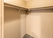 Thumbnail 55 of 73 - A closet with a grey sweater hanging on the rail at Graymayre Crossing Apartments, Spokane, 99208